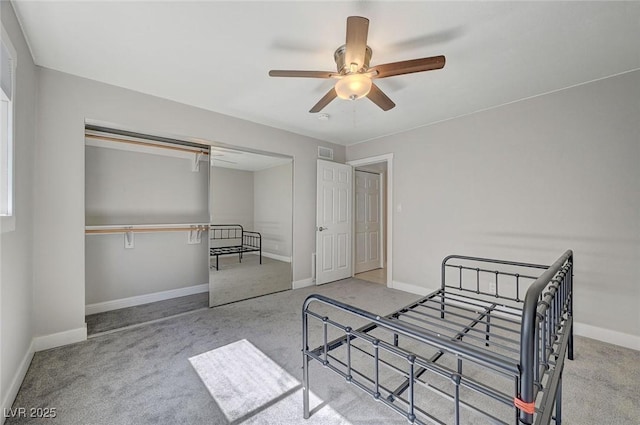 bedroom featuring a ceiling fan, carpet flooring, visible vents, and baseboards