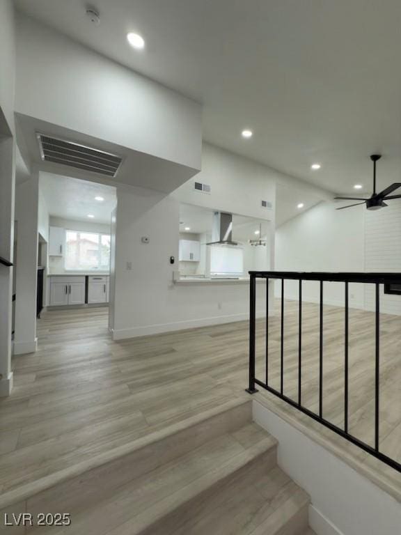 staircase with visible vents, recessed lighting, a ceiling fan, and wood finished floors