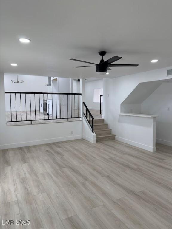 interior space with recessed lighting, baseboards, ceiling fan, and wood finished floors