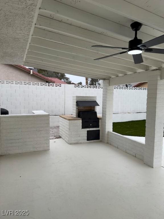 view of patio / terrace with fence and ceiling fan