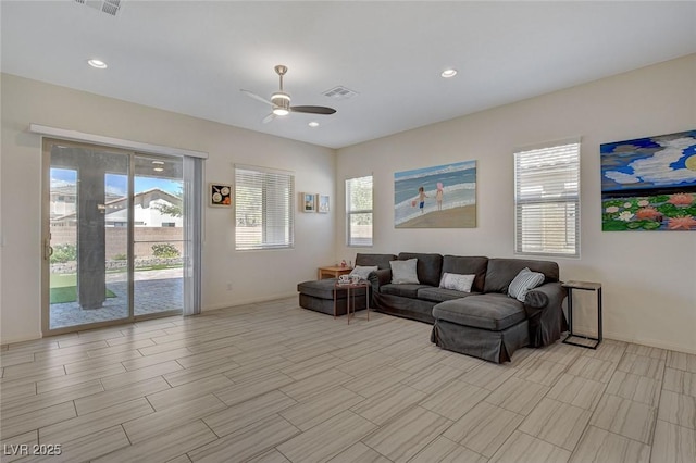 living room featuring visible vents, recessed lighting, baseboards, and ceiling fan