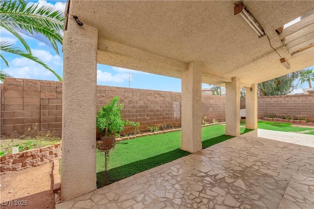 view of patio with a fenced backyard