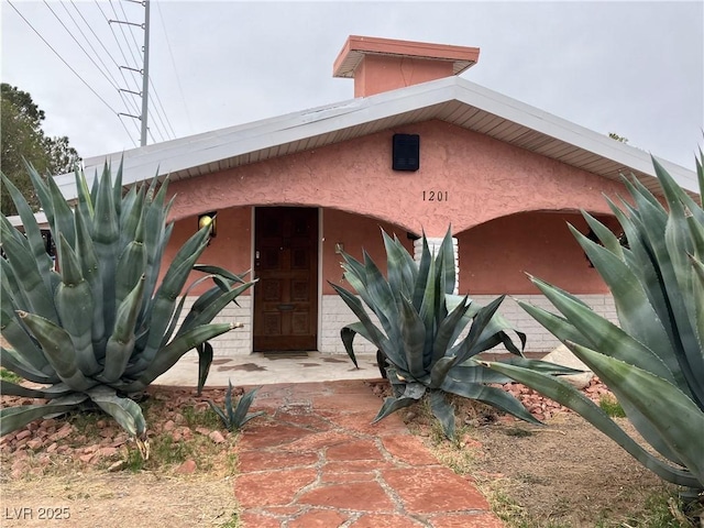 exterior space with stucco siding