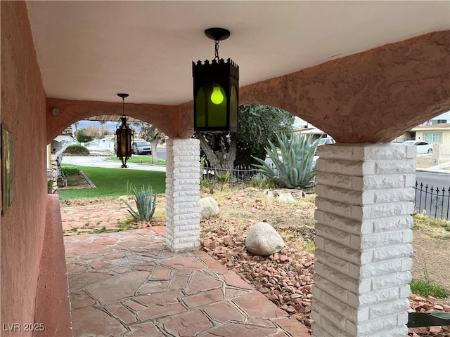 view of patio featuring fence