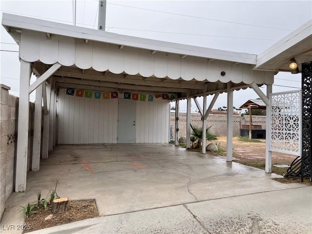 view of patio / terrace featuring fence