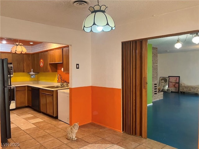 kitchen with visible vents, dishwasher, light countertops, white dishwasher, and a sink