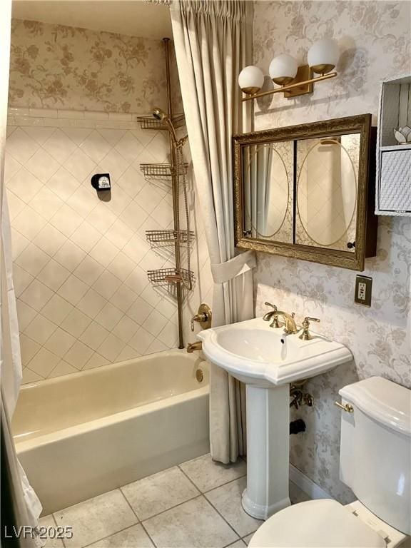 full bathroom with tile patterned floors, toilet, and wallpapered walls