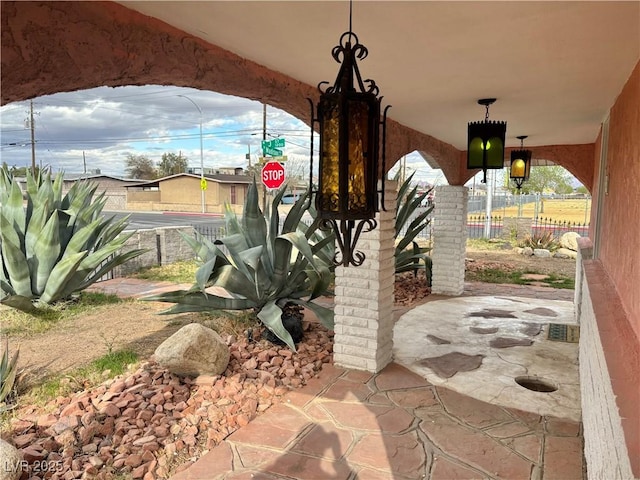 view of patio featuring fence