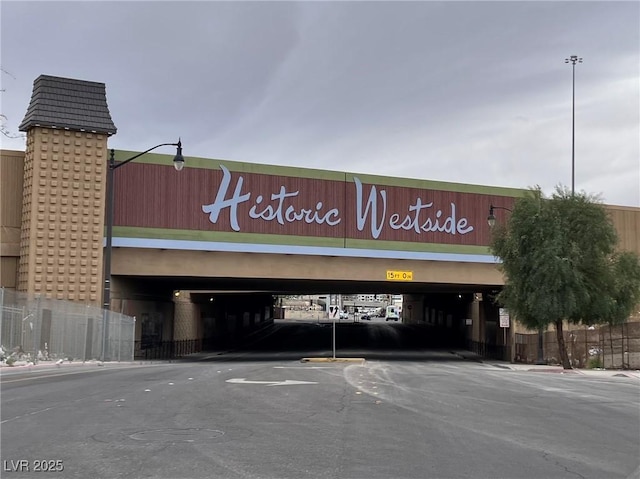 view of building exterior featuring uncovered parking