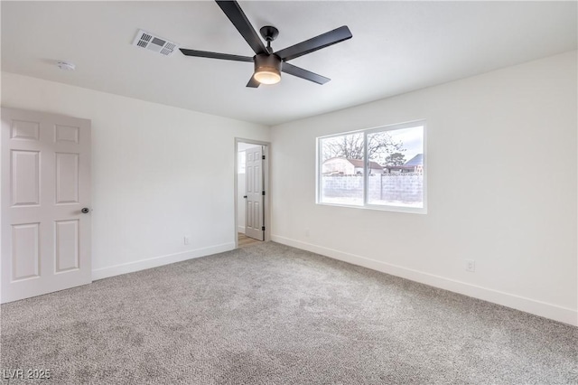 unfurnished bedroom with a ceiling fan, carpet, visible vents, and baseboards