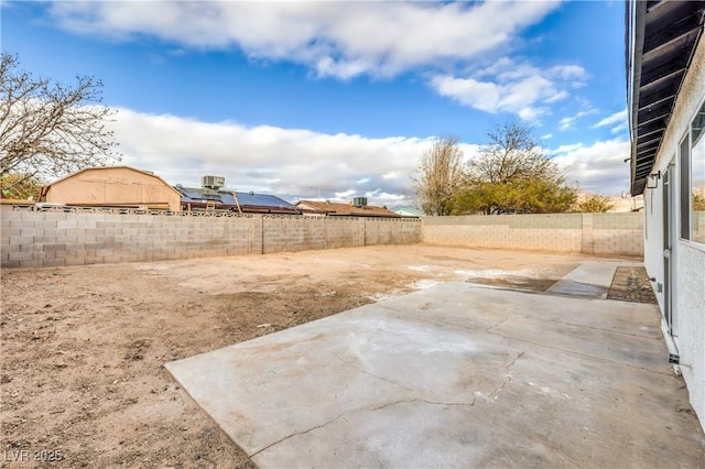 view of yard with a patio area and a fenced backyard