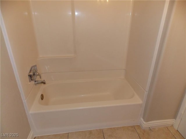 full bathroom featuring tile patterned flooring and baseboards