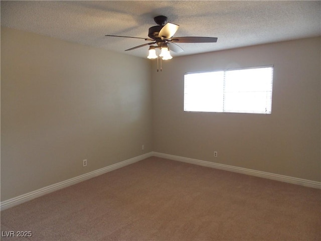 unfurnished room with light colored carpet, baseboards, a textured ceiling, and ceiling fan