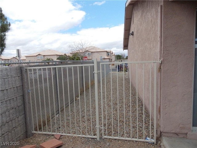 view of gate featuring fence