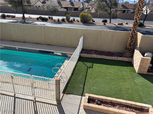 view of pool featuring fence private yard, a fenced in pool, and a residential view