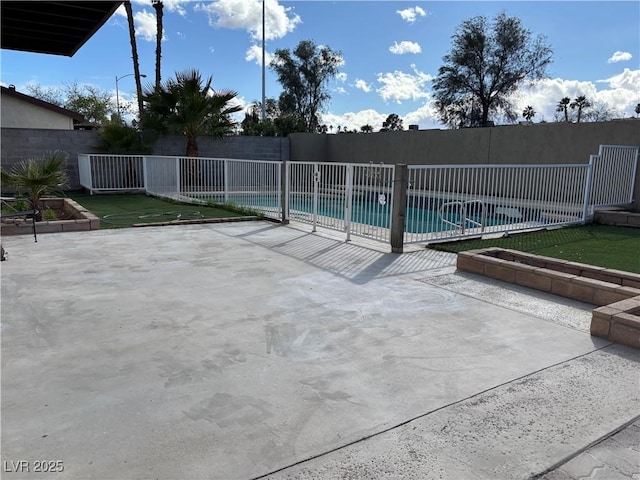 view of swimming pool featuring a pool, a patio, and fence