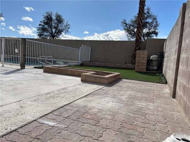 view of patio / terrace with a gate and fence