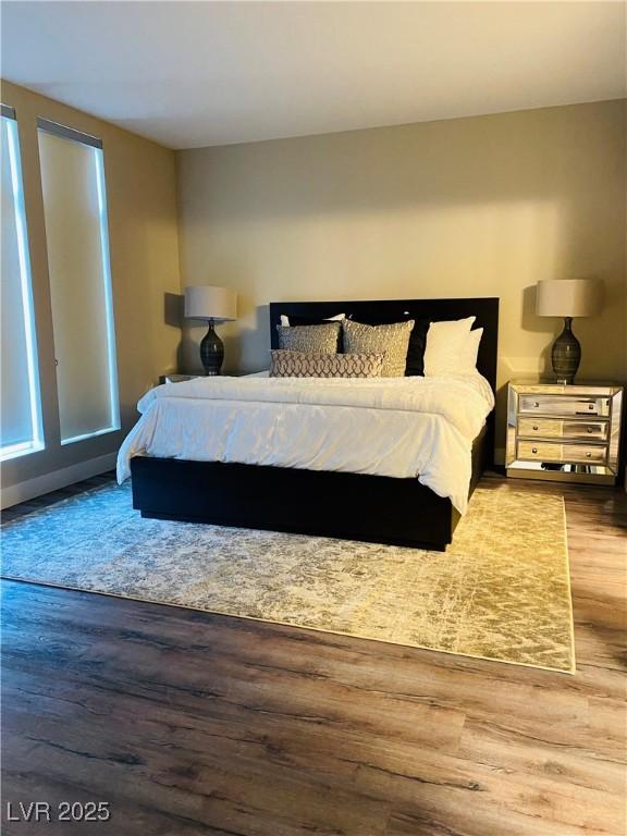 bedroom with wood finished floors