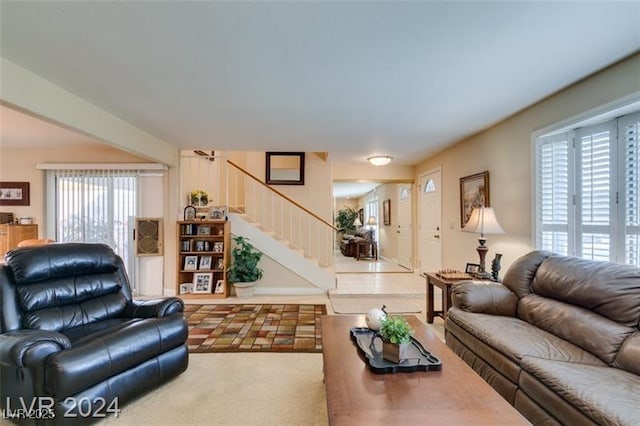 living area featuring stairs