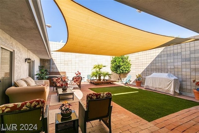 view of patio / terrace with a grill, outdoor lounge area, and fence