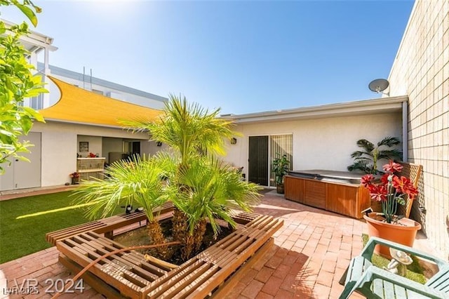 view of patio / terrace featuring a hot tub