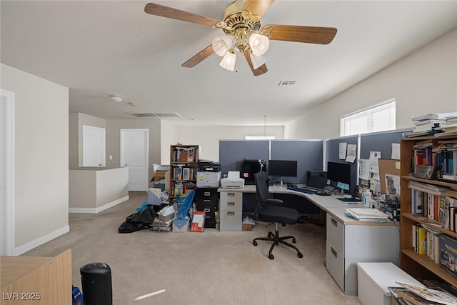 home office featuring a ceiling fan, light colored carpet, visible vents, and baseboards