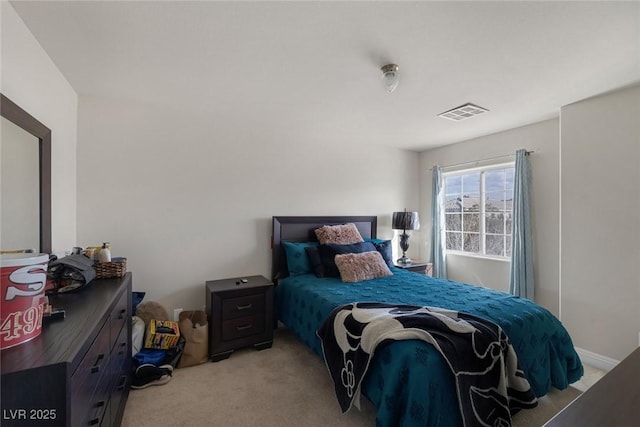 bedroom with light carpet and visible vents