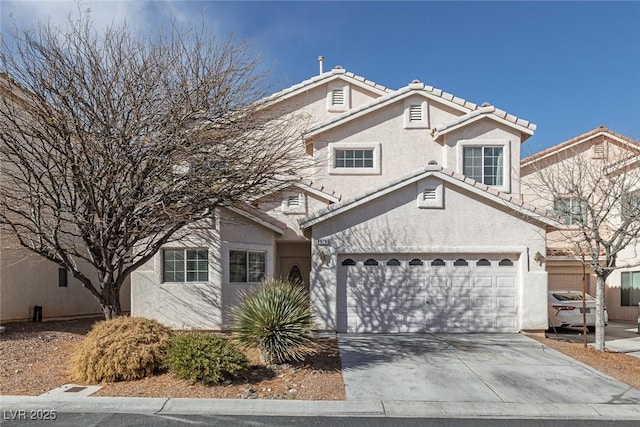 view of front of property featuring stucco siding, driveway, and a tile roof