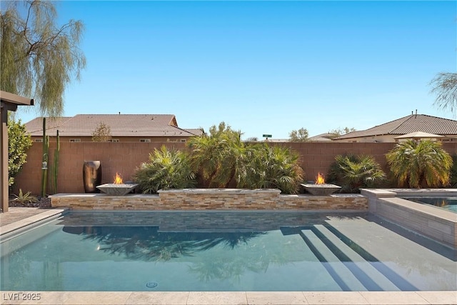 view of pool featuring a patio area, a fenced in pool, and a fenced backyard