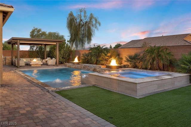 view of pool featuring a patio, a fenced backyard, a yard, an outdoor living space with a fire pit, and a fenced in pool