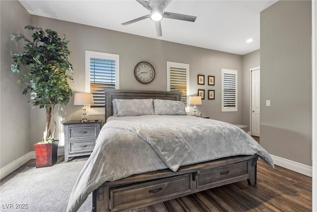 bedroom with baseboards, dark wood-style floors, and a ceiling fan