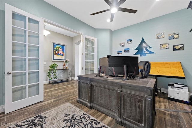 office area featuring wood finished floors, a ceiling fan, baseboards, and french doors