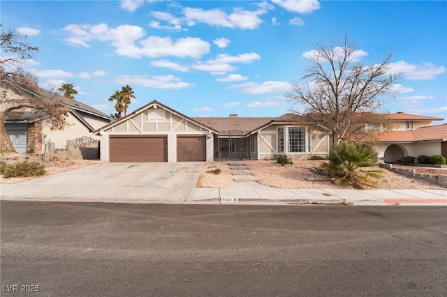 view of front facade featuring an attached garage, concrete driveway, and stucco siding
