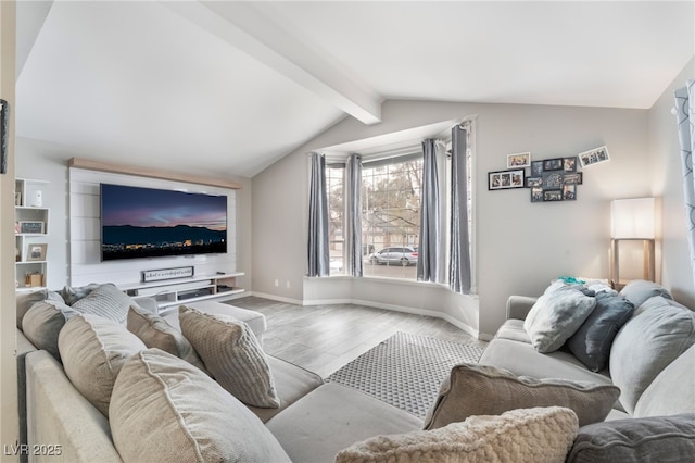 living room featuring lofted ceiling with beams, baseboards, and wood finished floors