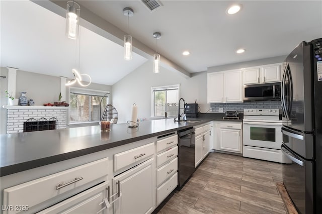 kitchen with dark countertops, visible vents, decorative backsplash, white cabinets, and stainless steel appliances