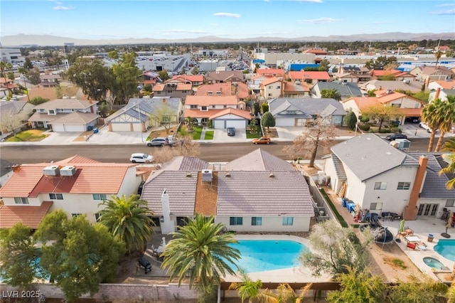 birds eye view of property with a residential view