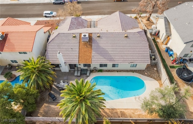 view of pool with a patio and a fenced backyard