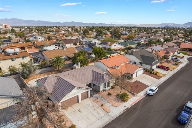 drone / aerial view with a residential view and a mountain view