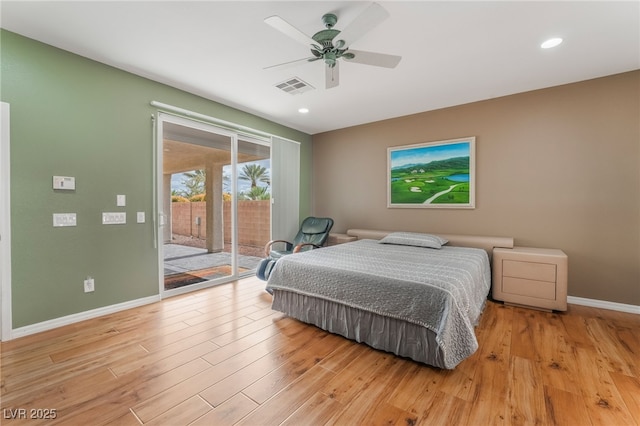 bedroom with visible vents, baseboards, light wood-style floors, and access to outside