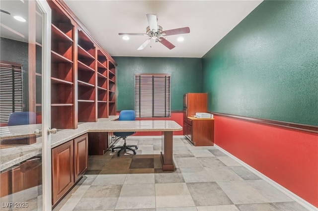 office space with baseboards, recessed lighting, a textured wall, built in study area, and a ceiling fan