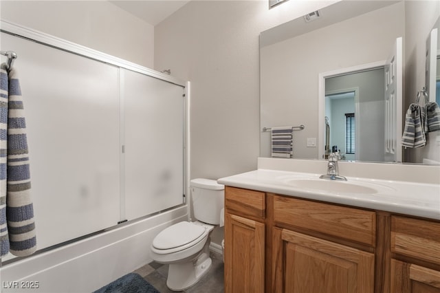 bathroom featuring combined bath / shower with glass door, toilet, and vanity