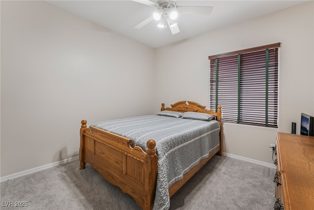 carpeted bedroom featuring baseboards and ceiling fan