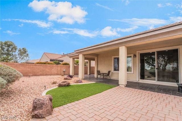 view of patio / terrace featuring fence