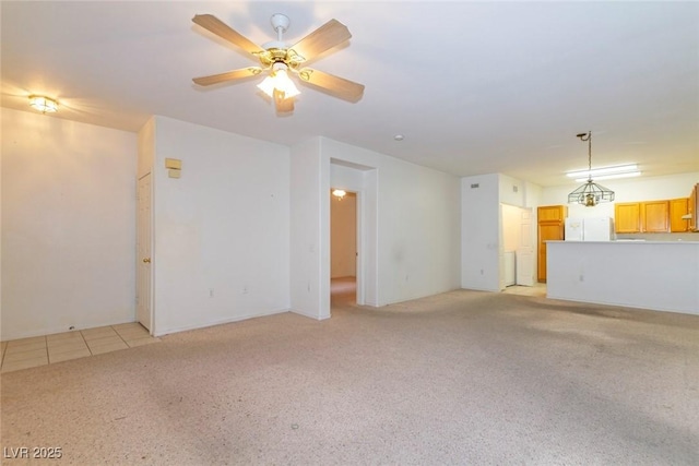 unfurnished living room with light colored carpet and a ceiling fan