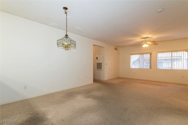 spare room featuring visible vents and a ceiling fan