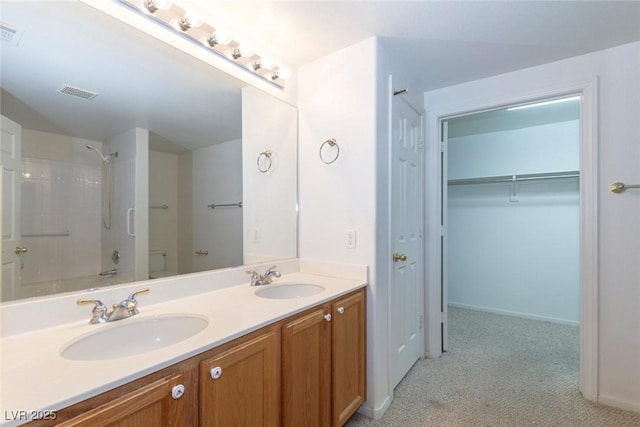 full bath featuring double vanity, shower / washtub combination, visible vents, and a sink