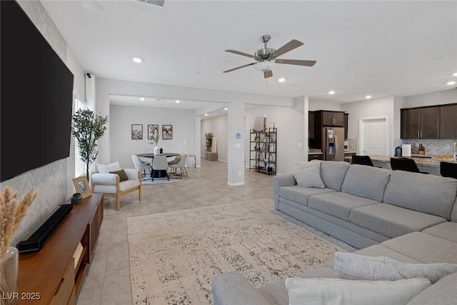 living room featuring recessed lighting and ceiling fan