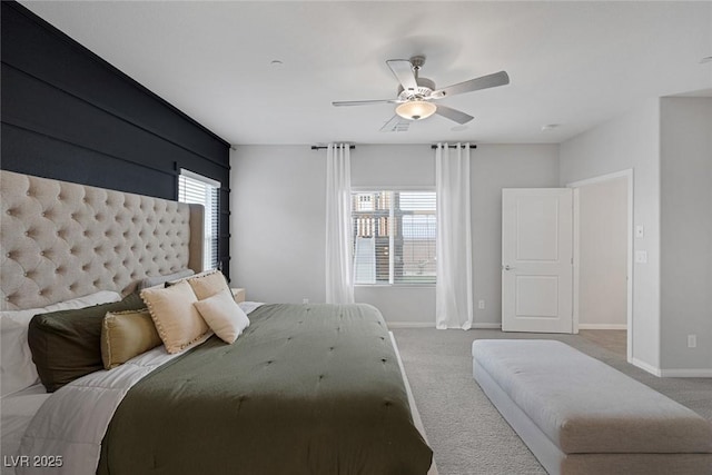 bedroom with baseboards, carpet floors, and a ceiling fan