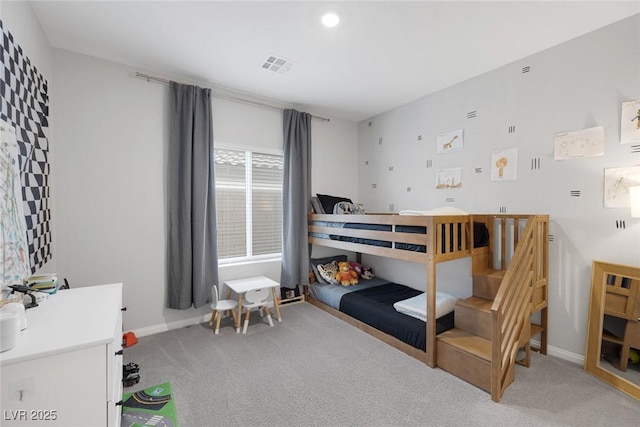 bedroom with light carpet, visible vents, and baseboards