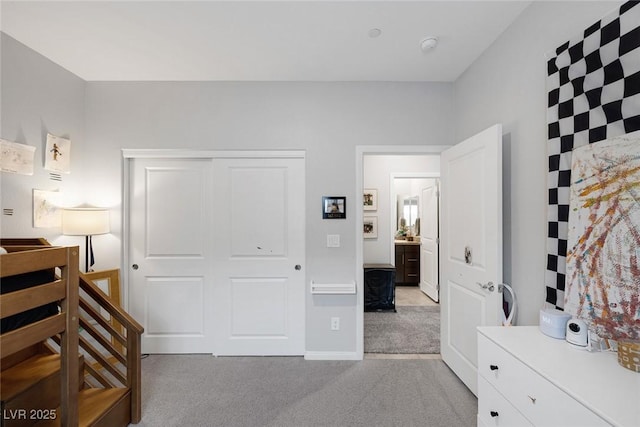 carpeted bedroom featuring a closet